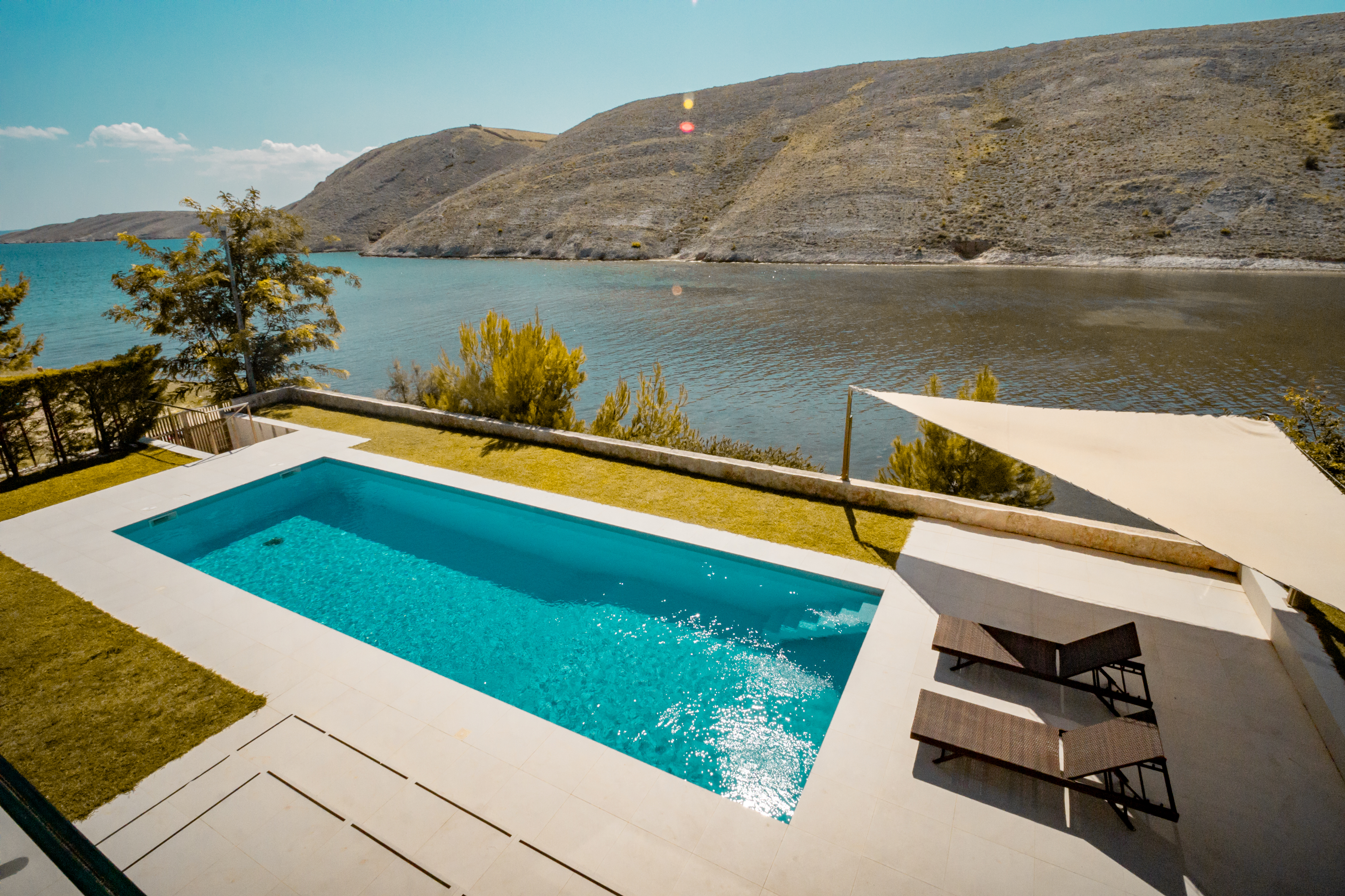 Seafront terrace with loungers